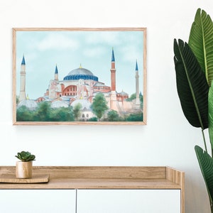 Puede incluir: Una pintura al agua enmarcada de la mezquita de Santa Sof&iacute;a en Estambul, Turqu&iacute;a. La mezquita est&aacute; pintada en tonos de rosa, rojo y azul con un cielo azul claro en el fondo.