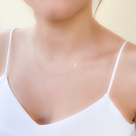 White gold sideways initial necklace top