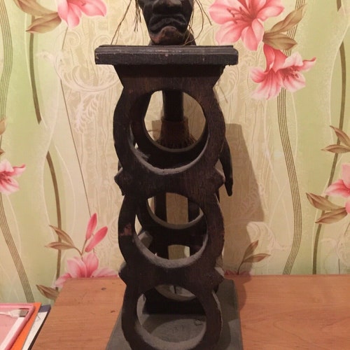 African figurine wine stand. Vintage selling wine stand made of wood. Height 53cm