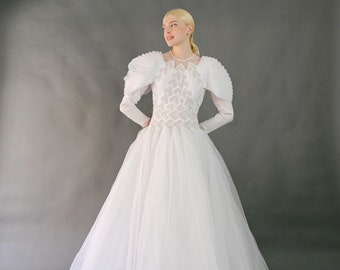 Vintage 1980s white wedding dress, ball gown silhouette, embroidered tinsels and strasses on the tulle bust,  extravagant sleeves S-M