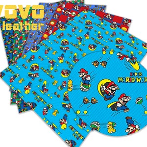 May include: A set of six colorful fabric sheets featuring a repeating pattern of Super Mario characters on a blue background. The sheets are printed with the text "Super Mario World".