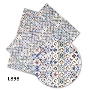 May include: A blue and white patterned tile design with a geometric pattern. The design is repeated in a circle and a rectangle.