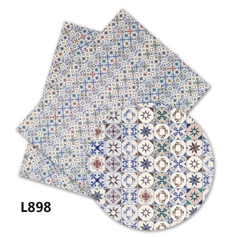 May include: A blue and white patterned tile design with a geometric pattern. The design is repeated in a circle and a rectangle.