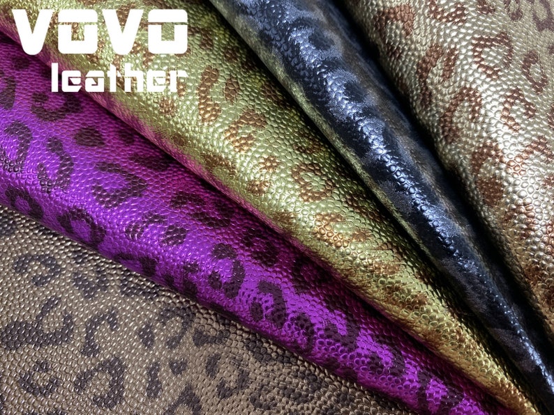May include: Four different colours of faux leather fabric with a leopard print pattern. The colours are gold, purple, black, and brown.