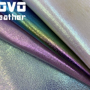 May include: Close-up of iridescent leather fabric in four colors: white, teal, purple, and light blue. The fabric has a textured, pebbled surface. The text "VOVO leather" is visible in the top left corner.