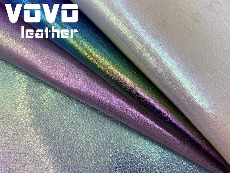 May include: Close-up of iridescent leather fabric in four colors: white, teal, purple, and light blue. The fabric has a textured, pebbled surface. The text "VOVO leather" is visible in the top left corner.