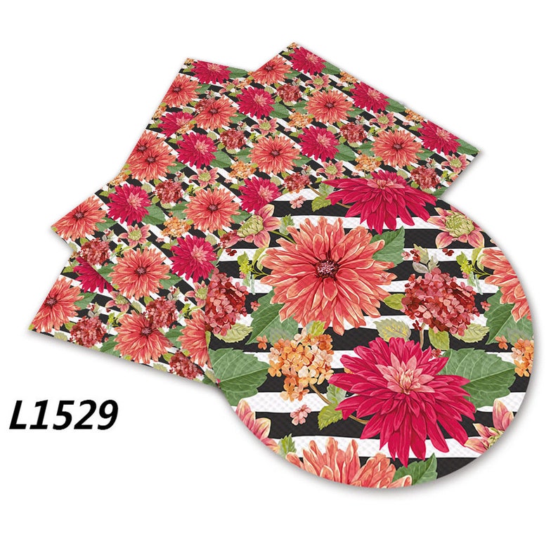 May include: Black and white striped fabric with a floral pattern featuring pink and orange flowers. The fabric is shown in a square and a circle shape.
