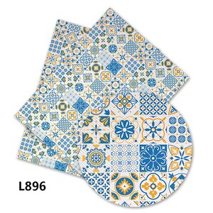 May include: A set of two blue and yellow patterned napkins with a geometric design. The napkins are made of fabric and have a white background. The text "L896" is printed on the bottom left corner of the image.