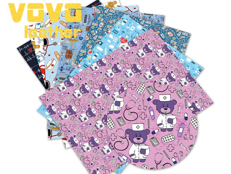 May include: A set of 8 patterned scrapbook paper sheets featuring a cute cartoon bear wearing a doctor's uniform and medical supplies. The paper is pink, blue, and white with a variety of medical-themed designs.