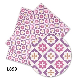 May include: Purple, pink, and cream patterned fabric with a geometric design. The fabric is folded in a stack and a circle of the same fabric is shown in the foreground. The text "L899" is printed in the lower left corner of the image.