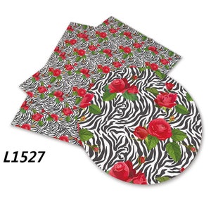 May include: Black and white zebra print fabric with red roses. The fabric has a repeating pattern of zebra stripes and red roses. L1527.