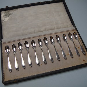 A set of 12 mocha/liqueur spoons, Art Deco model no. 3824.