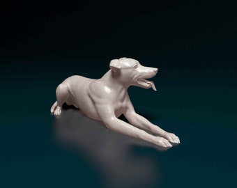 May include: A white ceramic sculpture of a dog lying down with its tongue sticking out. The dog is facing to the right and has a sleek, modern design.