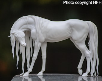 May include: A white sculpture of a horse with flowing mane and tail. The horse is in a graceful pose, with its head lowered and legs slightly bent. The sculpture is detailed and realistic, capturing the horse's anatomy.
