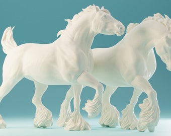 May include: Two white horse figurines standing side-by-side, both with long flowing manes and tails. The horses are in a walking pose with their legs raised.