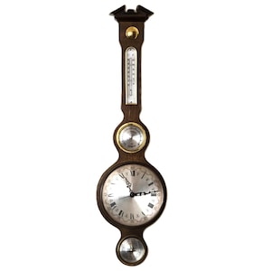 May include: A wooden weather station for the wall, featuring a clock, thermometer, and barometer. The clock has a silver face with Roman numerals and black hands. The thermometer displays Celsius and Fahrenheit. The barometer and clock are circular.