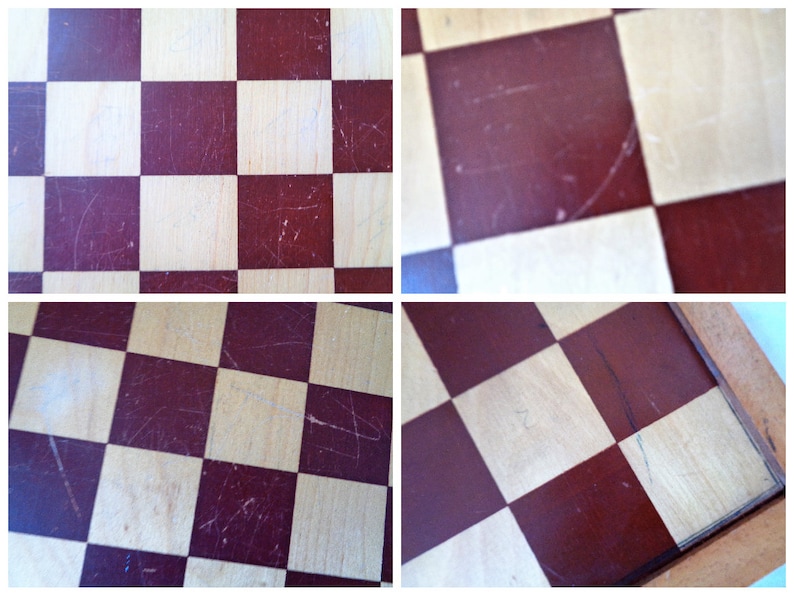 May include: A close-up of a wooden checkerboard with red and white squares. The board is worn and has scratches on the surface.