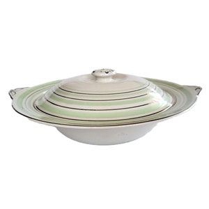 May include: White ceramic serving dish with a lid. The dish has a green and gold striped design.