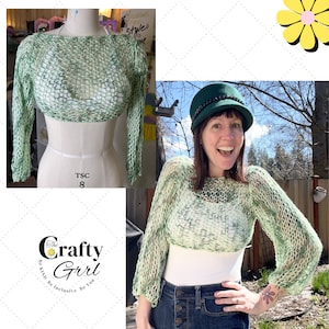 May include: A green crochet top with a loose, open weave. The top is shown on a mannequin and a person wearing it with blue jeans. The text "The Crafty Girl Be Kind Be Inclusive Be You" is visible in the image.