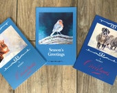 Three large Christmas cards designed by British artist