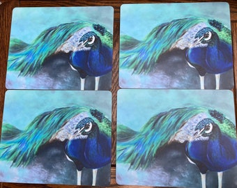 Pack of four placemats featuring stunning peacock painting