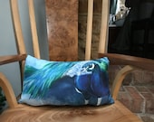 Luxurious peacock cushion by British artist