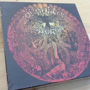 May include: A black vinyl record album cover with a circular design featuring a Celtic knotwork pattern in shades of red, orange, and yellow. The center of the design features a black bird with outstretched wings and the text "WOLVES IN THE THRONE ROOM" in a stylized font.