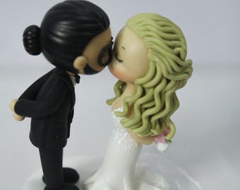 Bride & Groom wedding cake topper, Curly half updo hairstyle bride, man bun full beard groom, trumpet mermaid V-neck fitted wedding dress