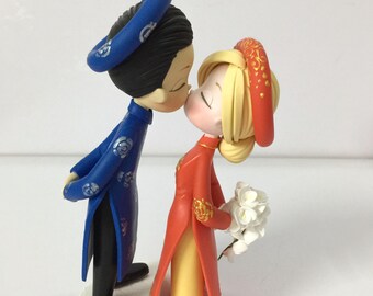 Vietnam wedding cake topper, Ao dai bride & groom sculptor, Kissing mixed race couple handmade clay figurine