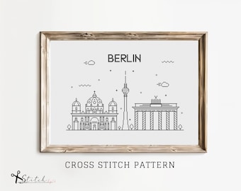 May include: Black and white line art cross stitch pattern of the Berlin skyline featuring the Brandenburg Gate and the Berlin Cathedral. The text "BERLIN" is above the skyline and "CROSS STITCH PATTERN" is below the skyline.
