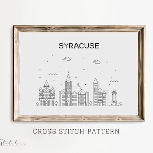 Puede incluir: Un patrón de punto de cruz en blanco y negro del horizonte de Syracuse. El patrón incluye edificios, árboles y un cielo estrellado. El texto "SYRACUSE" y "CROSS STITCH PATTERN" están incluidos en la imagen.