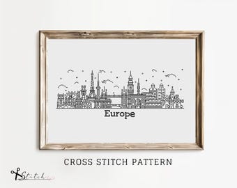 May include: Black and white line art cross stitch pattern of a European city skyline with the word "Europe" below the image. The pattern includes iconic landmarks such as the Eiffel Tower, Big Ben, and the Brandenburg Gate.