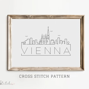 May include: Black and white cross stitch pattern of the Vienna skyline with the word "VIENNA" underneath.