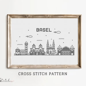 Peut inclure: Motif de point de croix noir et blanc du ciel de Bâle, mettant en scène plusieurs bâtiments, dont une église avec deux tours. Le texte "BASEL" est au-dessus du ciel, et le texte "CROSS STITCH PATTERN" est en dessous du ciel.