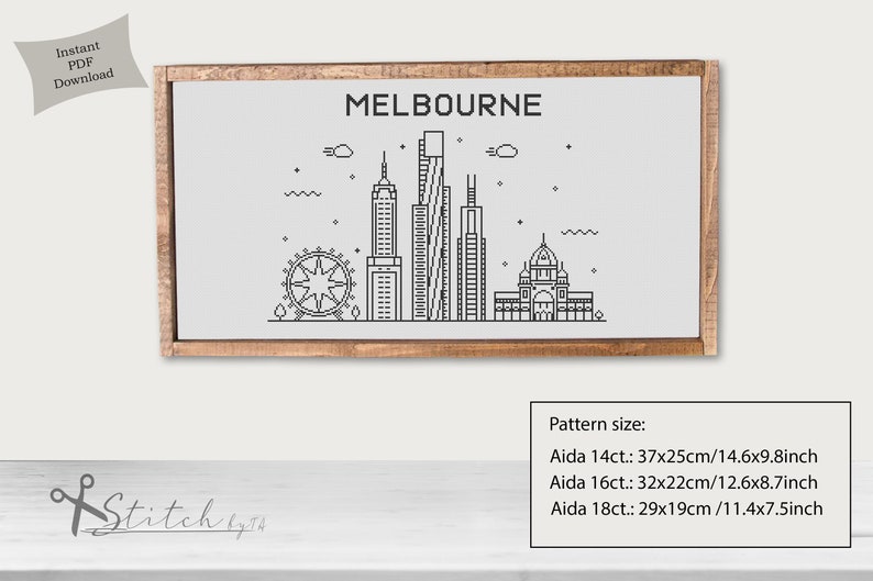 May include: A black and white line art illustration of the Melbourne skyline, including the Melbourne Star Observation Wheel, Federation Square, and several skyscrapers. The illustration is framed in a light brown wood frame and is labeled "MELBOURNE". The text "Pattern size:" is below the image, followed by the dimensions of the pattern in inches and centimeters for Aida 14ct, 16ct, and 18ct.