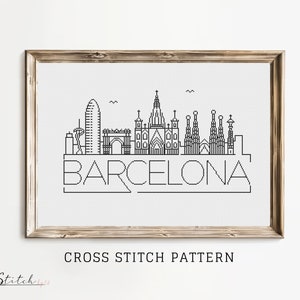 May include: Black and white cross stitch pattern of the Barcelona skyline, featuring iconic buildings like the Sagrada Familia and the Sagrada Familia. The pattern includes the word "BARCELONA" in a stylized font.