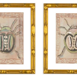 May include: Two framed prints of stylized green and pink beetles with white accents on a pink background. The prints are framed in gold with a decorative border.