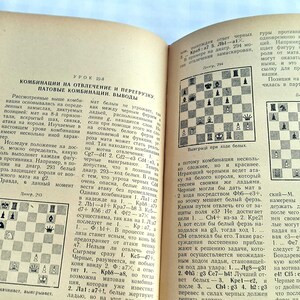 May include: A vintage book with a black and white chessboard diagram on each page. The book is open to a page titled "Combinations on Diversion and Overload" and includes the text "Combinations on Diversion and Overload, Pat Combinations, Conclusions".