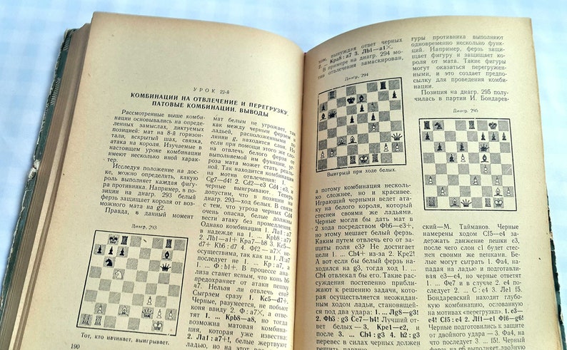 May include: A vintage book with a black and white chessboard diagram on each page. The book is open to a page titled "Combinations on Diversion and Overload" and includes the text "Combinations on Diversion and Overload, Pat Combinations, Conclusions".