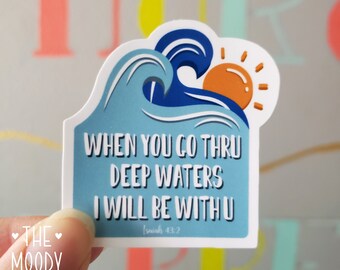 May include: A blue and white sticker with a wave and sun design. The sticker has the text "WHEN YOU GO THRU DEEP WATERS I WILL BE WITH U" and "Isaiah 43:2".