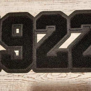 May include: Black felt patch with the year 1922 in large, bold, white letters.