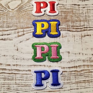 May include: Four embroidered iron-on patches with the word "PI" in different colors: red, yellow, pink, and blue.