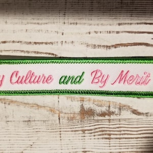 By Culture and By Merit iron-on embroidered 5&quot; X 1&quot; patch