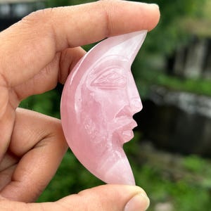 Celestial Craftsmanship: The Rose Quartz Moon Face Carving
