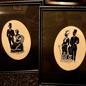 Vintage Pair of Framed Silhouette pictures by Heasley, Edwardian man and woman paper cut art