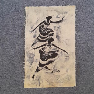 May include: Monochrome artwork showing two dancing figures. The figures are rendered in a simple, stylized manner against a textured, off-white backdrop. The artwork is signed "Beth N."