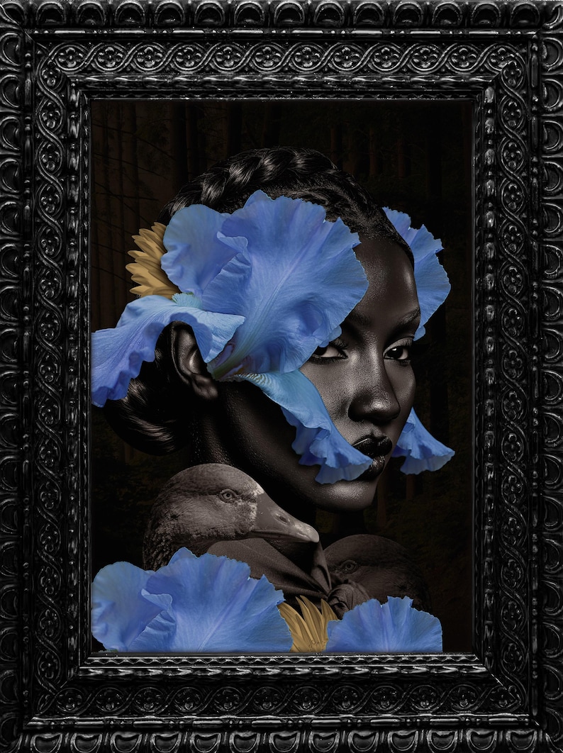 May include: A framed artwork featuring a woman's face adorned with blue iris petals and a yellow flower. The artwork also includes a depiction of a duck. The frame is black with ornate detailing, creating a striking contrast.