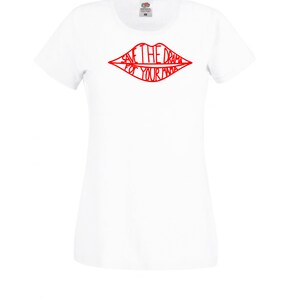 May include: White t-shirt with a red outline of a pair of lips that says "Save the drama for your mama".