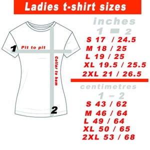 May include: A white t-shirt graphic with size measurements in inches and centimeters. The text reads "Ladies t-shirt sizes" at the top. Sizes are provided for S, M, L, XL, and 2XL, with measurements for pit-to-pit and collar-to-hem.