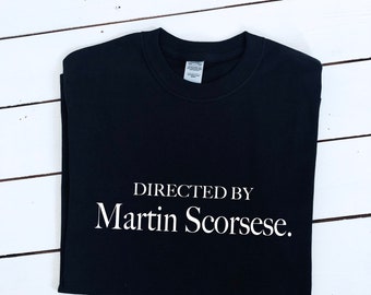 May include: Black t-shirt with white text that reads "DIRECTED BY Martin Scorsese."